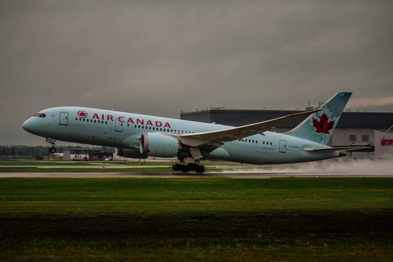An Air Canada plane taking off from the runway