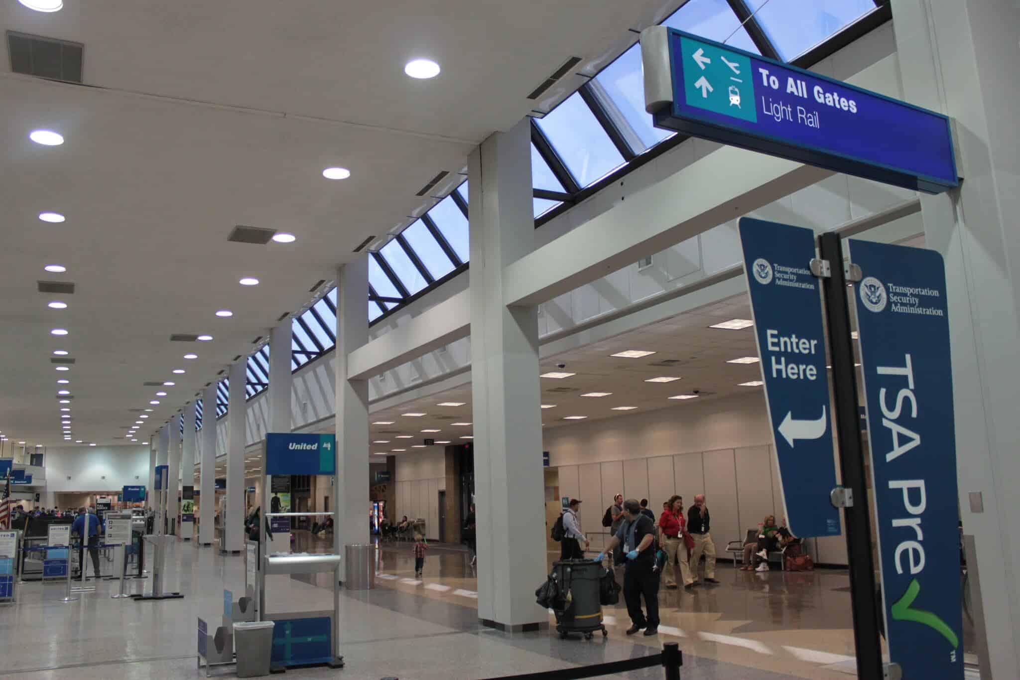 TSA PreCheck lane sign at an airport