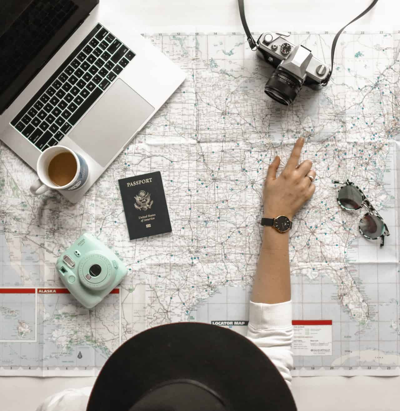 A travel agent pointing to a map on a table