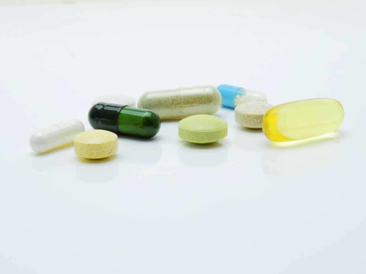 Medication in pill and liquid form on a table