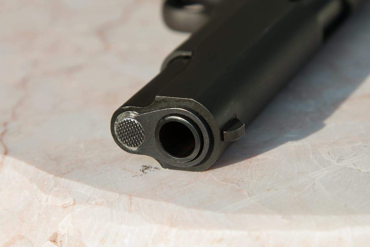 A black firearm handgun on a table