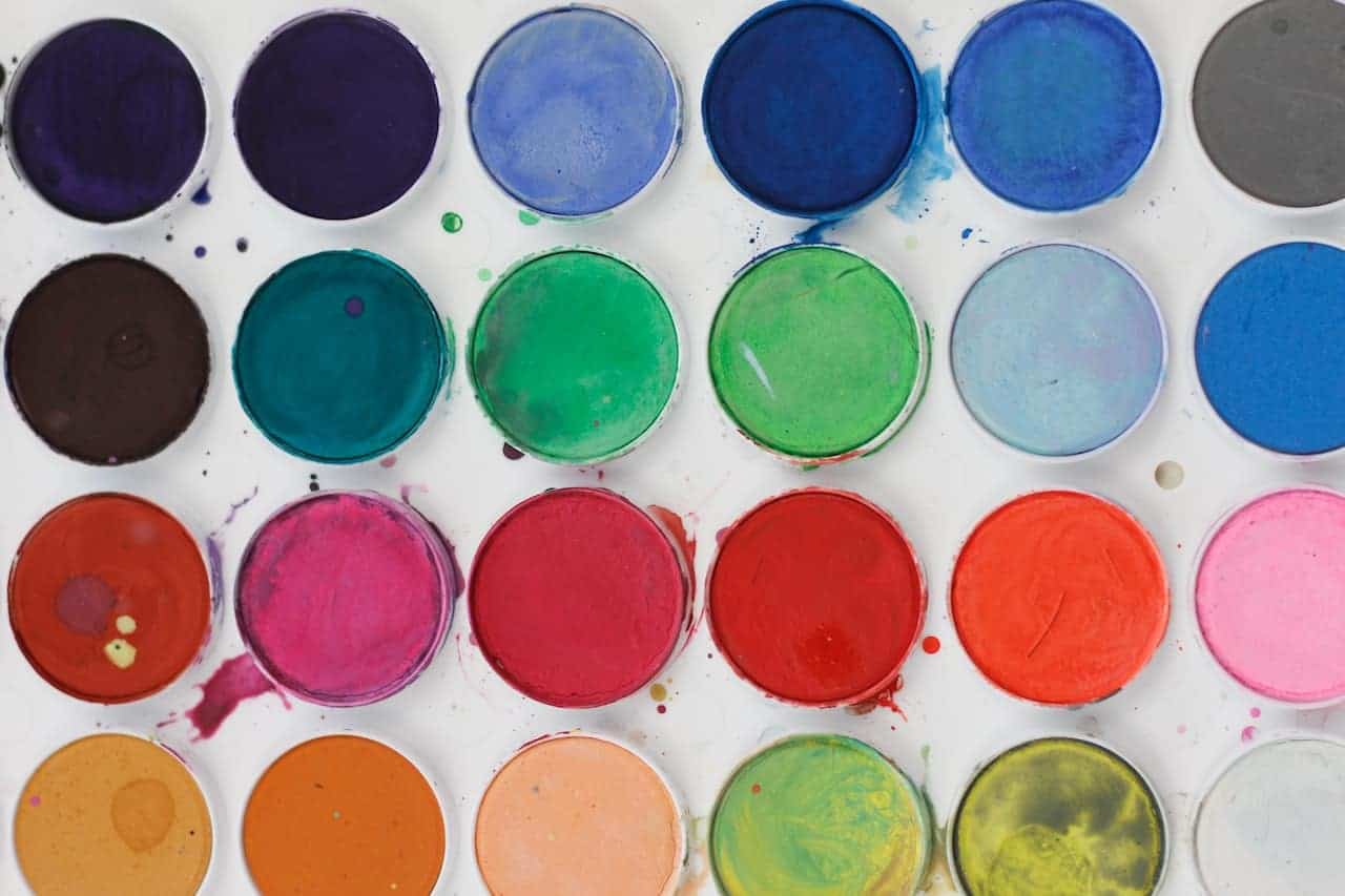 an assortment of paints in different colors