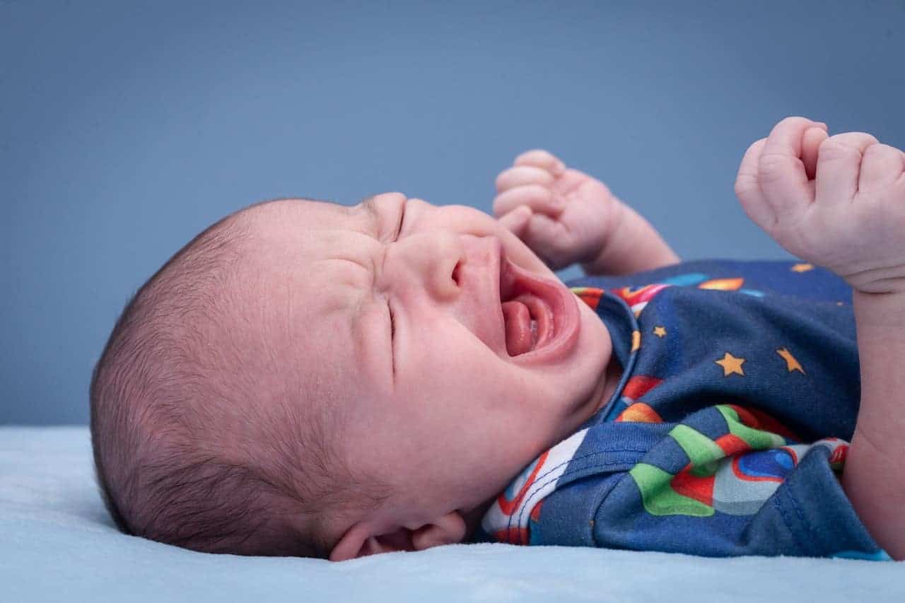 a baby crying on a plane