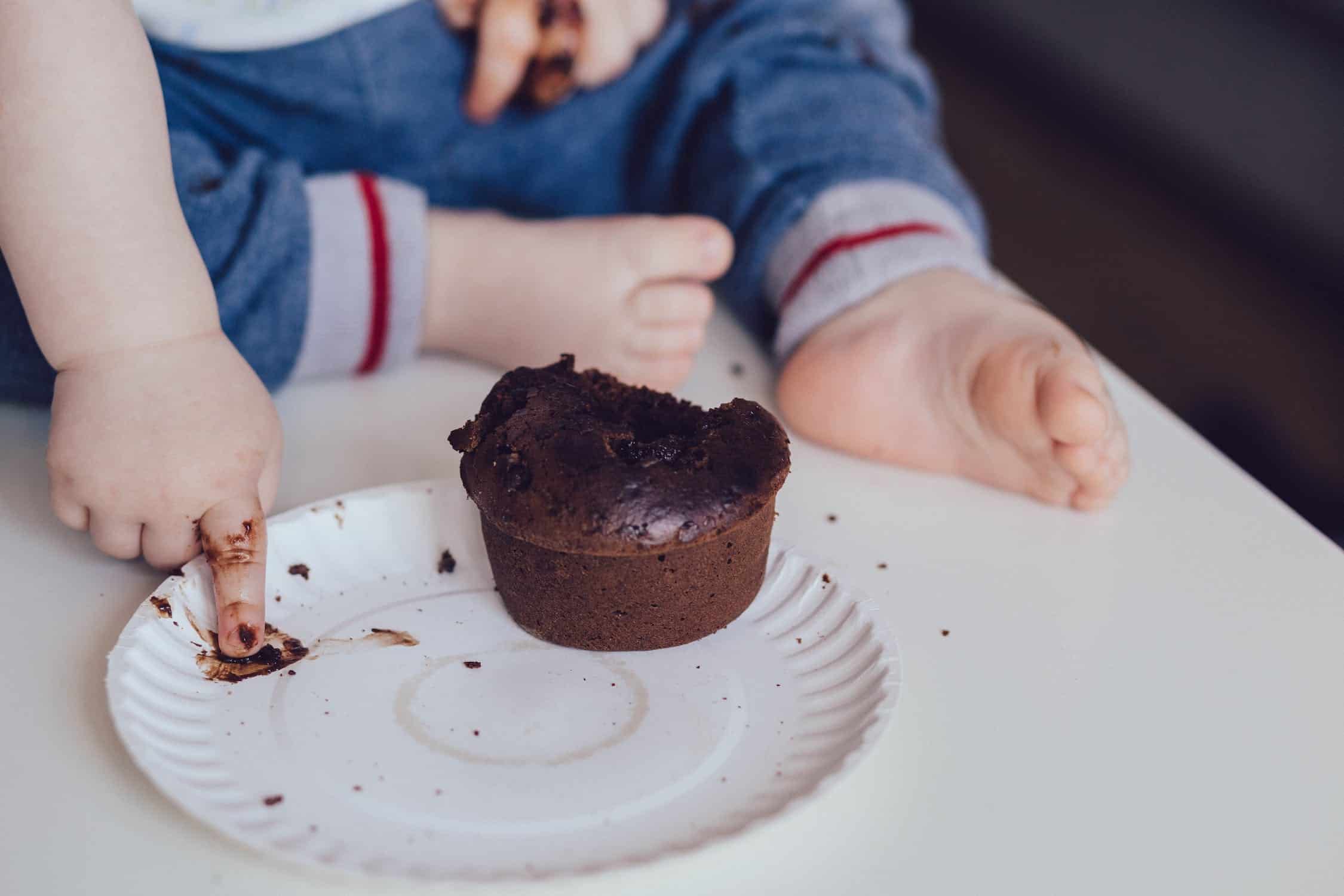 toddler eating chocolate cake