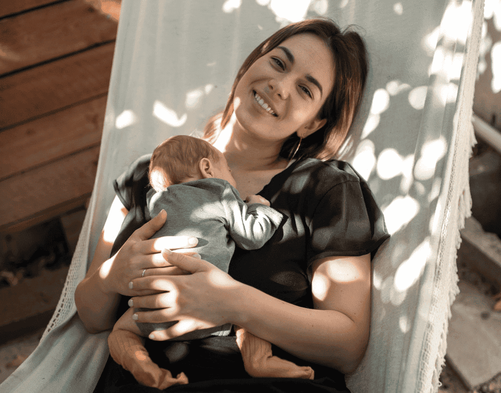 baby sleeping on mother's chest