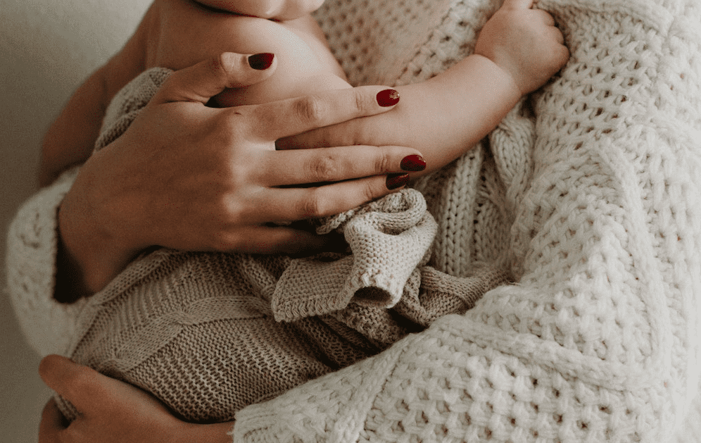 baby resting on mother's chest