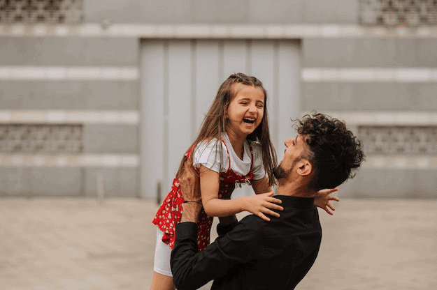 Dad and daughter laughing together