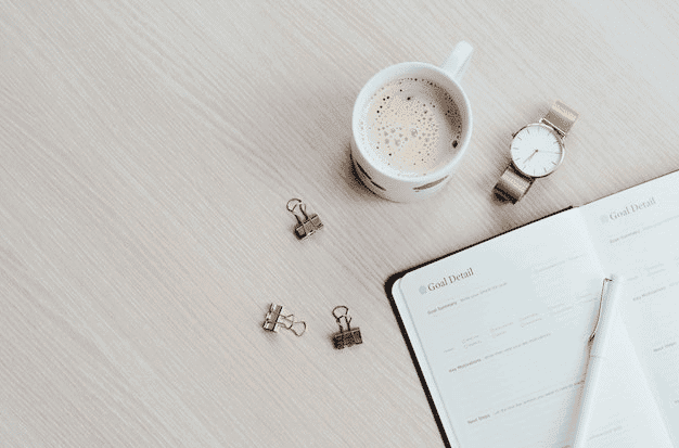 Schedule Planner And Coffee On Table