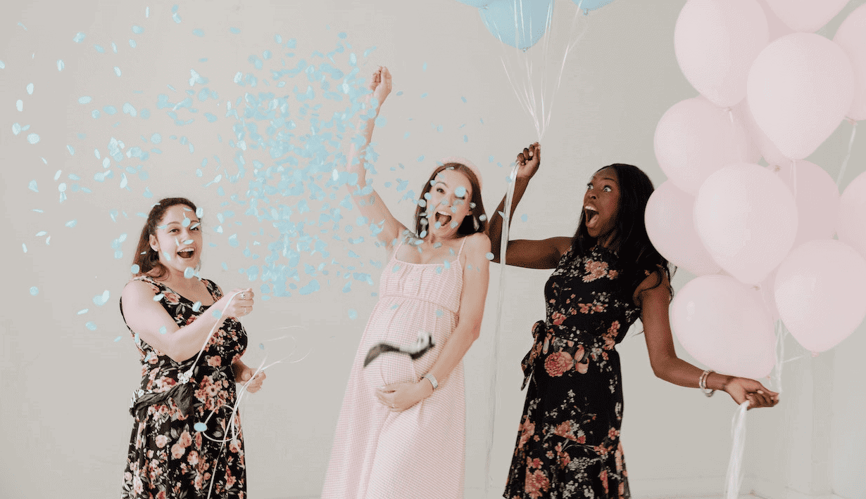 Pregnant Woman Celebrating With Friends