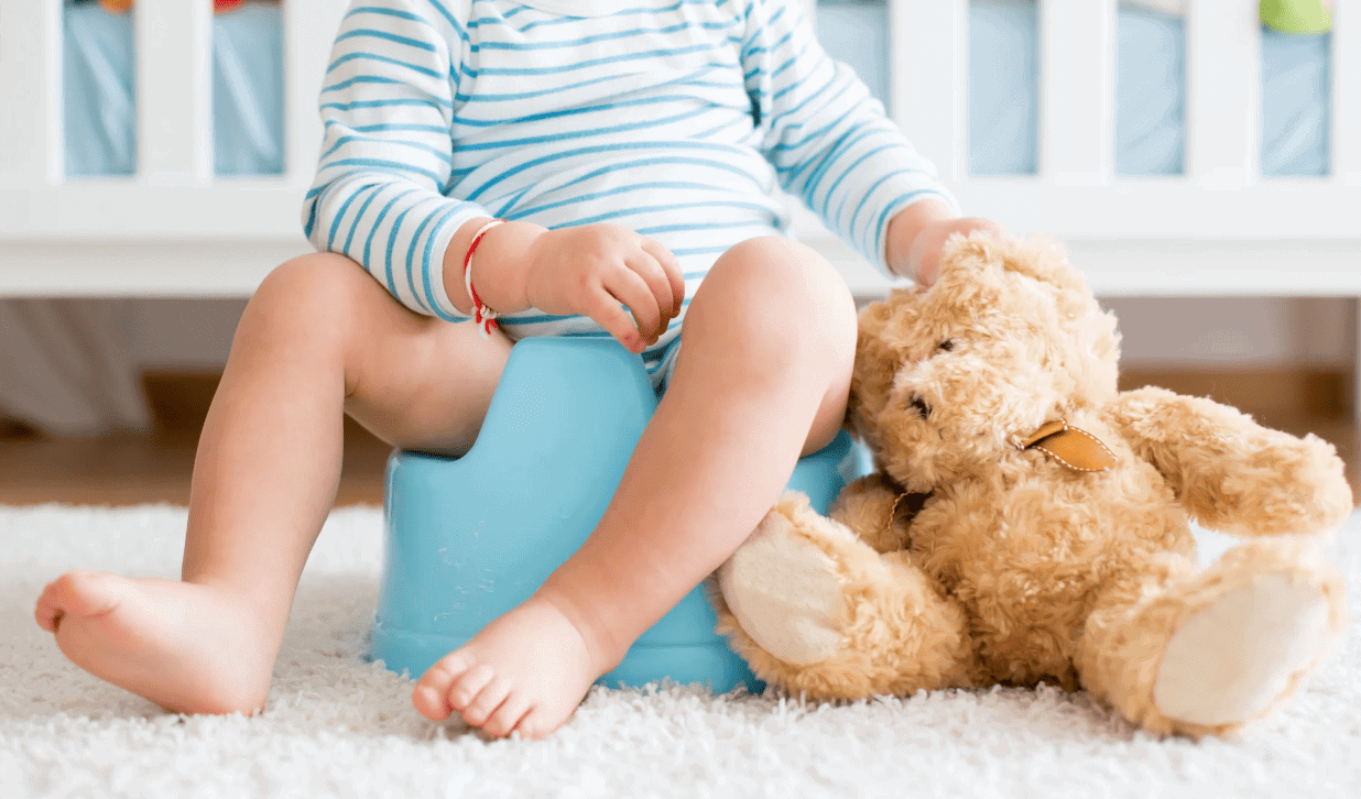 Toddler Sitting On A Potty