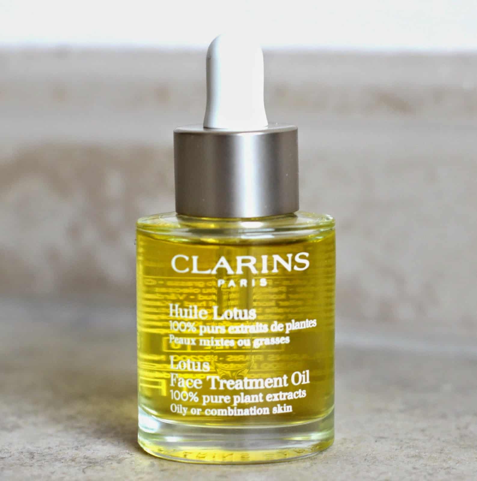 Clarins Lotus Face Treatment Oil زيت لوتس لمعالجة الوجه من كلارنس - الصورة 1