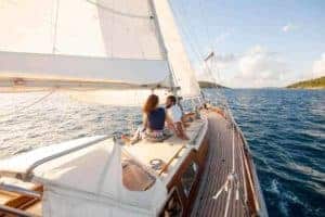Couple enjoying Romantic sunset sail onboard Cimmaron Yacht Charters