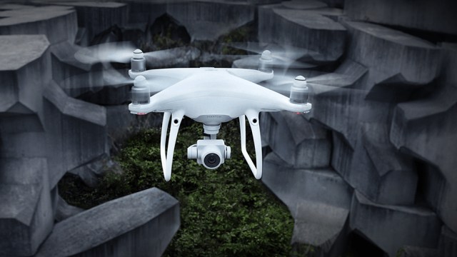 DJI Phantom 4 Advanced flying through a dark rocky landscape