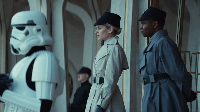Dedra Meero standing with another ISB officer by a stormtrooper in Andor season 2