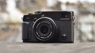A Fujifilm X-Pro 2 sitting on concrete