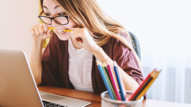 A person at a laptop.