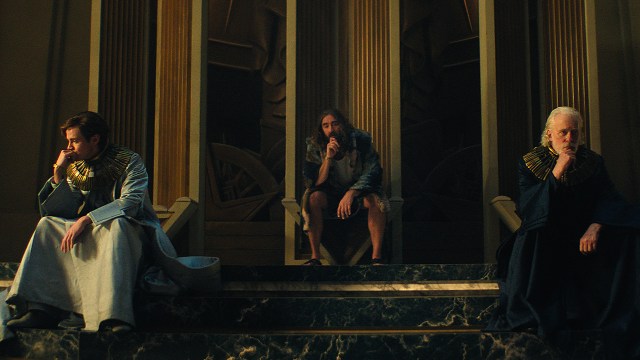Brother Dawn, Brother Day, and Brother Dusk sitting in their throne room in Foundation season 3