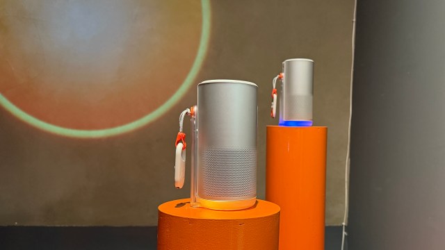 The XGIMI MoGo 4 portable projector on a stand in a display room