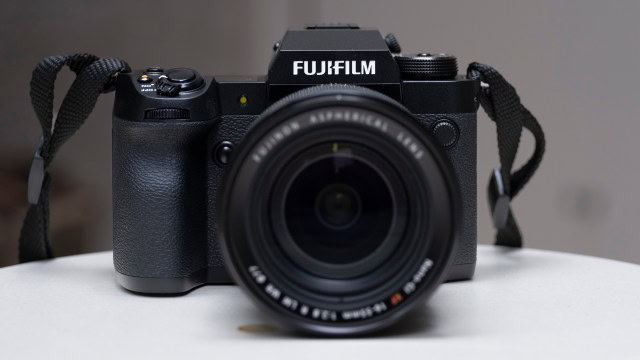 The Fujifilm X-H2 camera setting on a white table