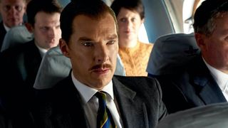 A still from The Courier in which Benedict Cumberbatch's character Greville Wynne travels on a plane.