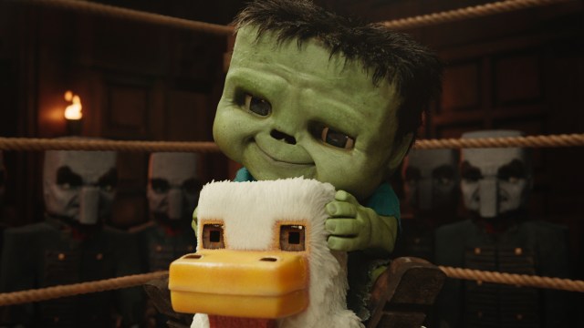 A zombie baby sitting on a chicken in a boxing ring in A Minecraft Movie