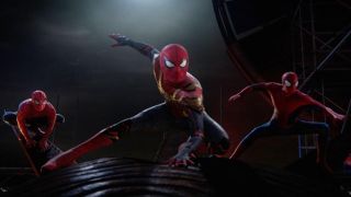 The three live-action Spider-Men pose on a rooftop in Spider-Man: No Way Home