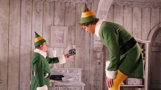 A still from the movie Elf in which Will Ferrell's character Buddy the Elf is talking to Bob Newhart as Papa Elf