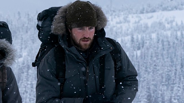 Spencer trudging through the snow in The Last of Us season 2