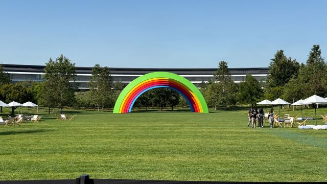 Images from around Apple Campus during WWDC 2025 including rainbow logos and graphics for Pride
