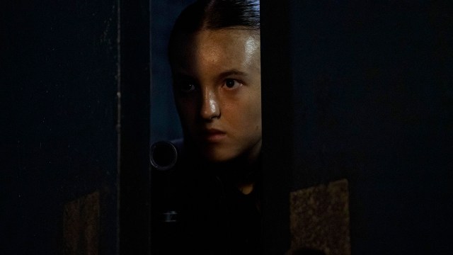 Ellie peeking through a slightly open door in The Last of Us season 2 finale