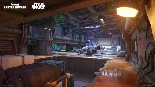 An X-Wing docked in an underground hangar