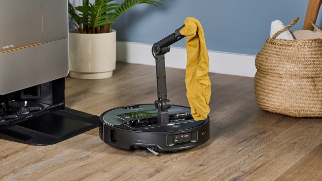 Roborock Saros Z70 robot vacuum holding a sock