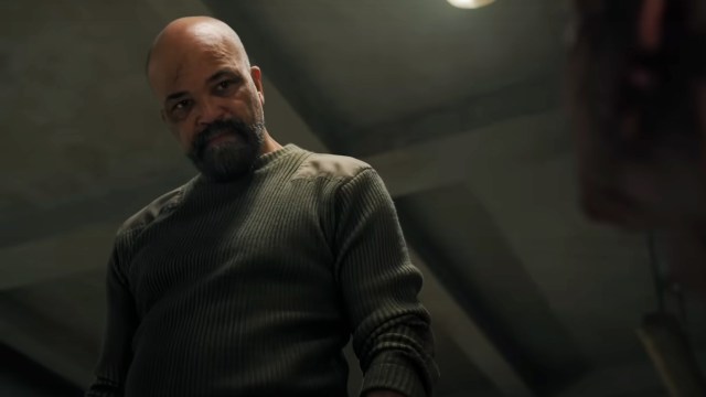 Isaac looking down at a prisoner in The Last of Us season 2