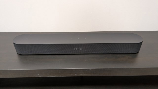 Sonos Beam on dark wood stand