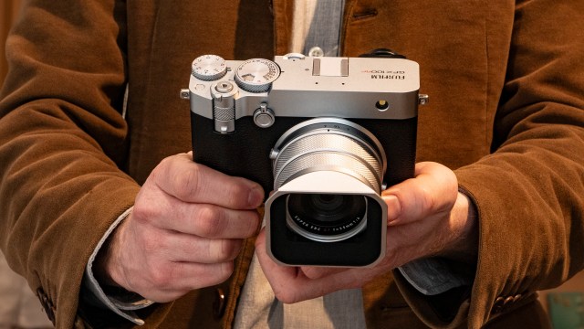 Holding the Fujifilm GFX100 RF medium-format compact camera