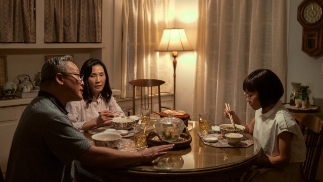 Amy sits with her family at a dinner table in Beef season 1