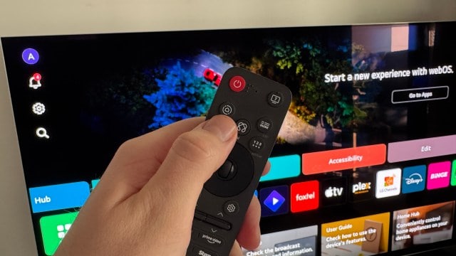 LG's new Magic Remote held in a hand.
