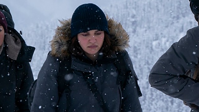 Mel walking in the snow alongside her fellow Fireflies in The Last of Us season 2
