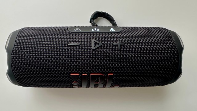 JBL Flip 7 portable Bluetooth speaker on a white surface