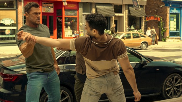 Reacher grips a man's wrist in his hand