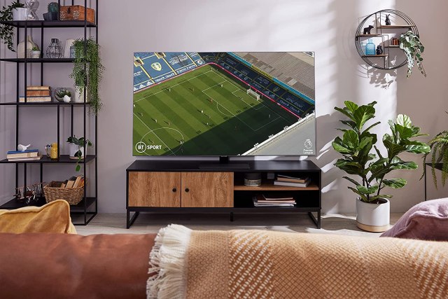 amsung 50 Inch Q80A QLED 4K Smart TV (2021) in living room showing football