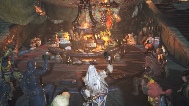 Hunters gather around a table, raising their tankards in sync