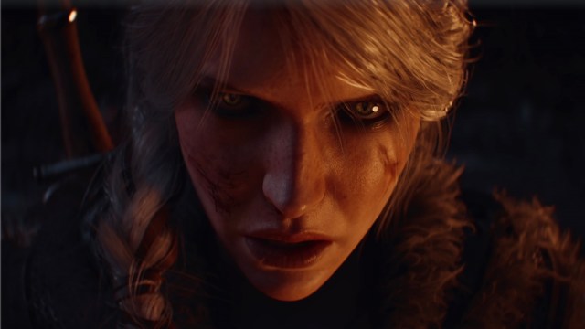 A close up of Ciri's face, lit by firelight