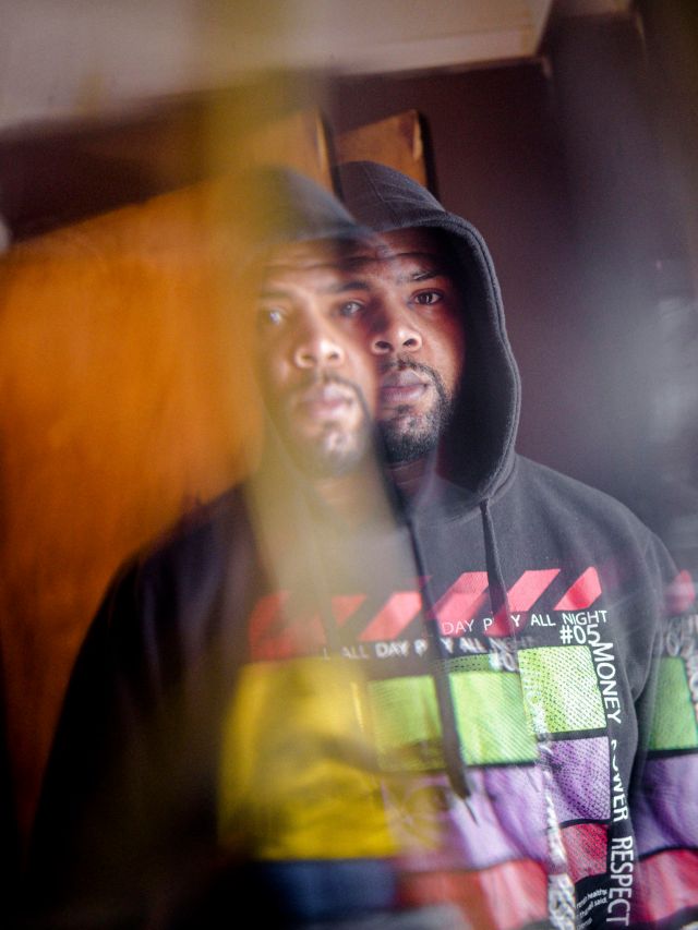 Robert McDaniel posing for a portrait at his home in Chicago’s Austin neighborhood.