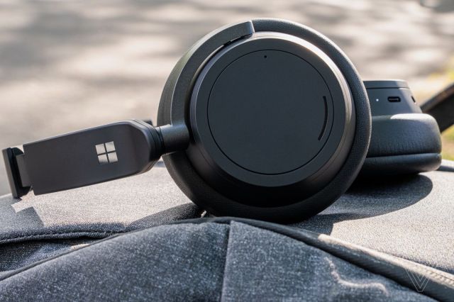 An image of the Surface Headphones 2 resting on a backpack.