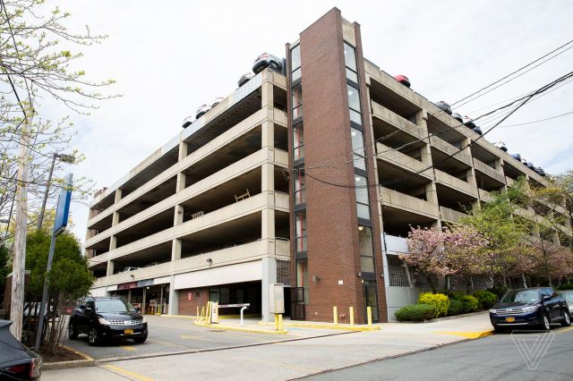 Electric vehicle charging stations in New York City are often inside paid parking lots. 