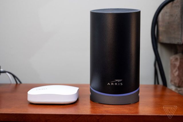 An Eero Pro router next to an Arris Surfboard Max Pro. The Max Pro is significantly larger.