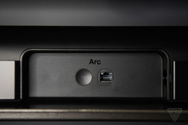 A detail shot of the back of the Sonos Arc, showing the ethernet jack and power button.