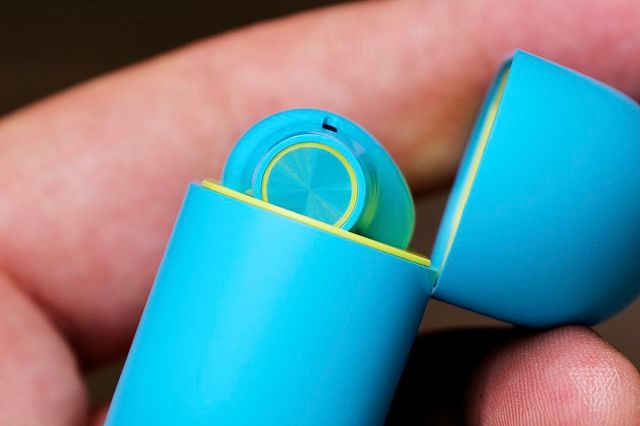 A side profile shot of the OnePlus Buds that shows the circular tap area for controls.