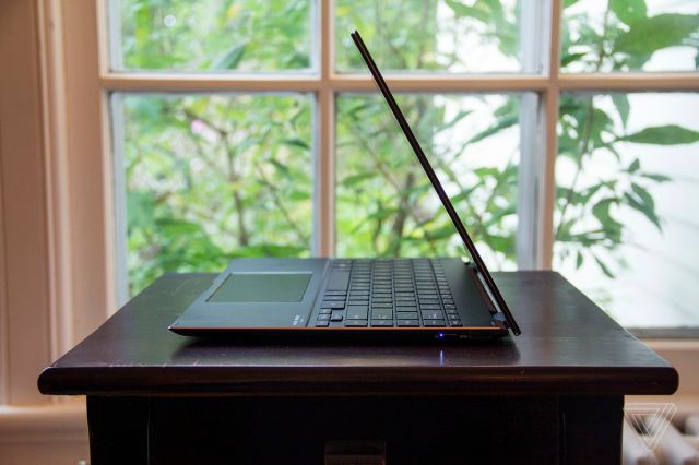 The Asus Zenbook Flip S half open from the left side.